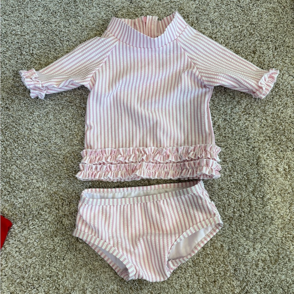 Baby girls pink seersucker swim suit. Used a few times, like new condition.